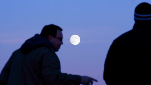 The view from Hurst Castle.  As the sun went down behind, the moon came up.