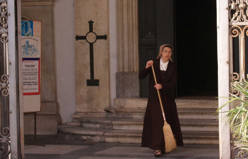 After seeing the Pantheon, we grabbed some ice cream and wandered east.  Just as we were leaving the piazza, I spotted a nun sweeping the entrance to a church.  Unfortunately, she noticed me while I was swapping lenses.