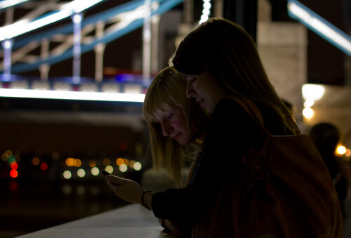 Claire and Claire by Tower Bridge during London 2012.  Not having much in the way of flashes or tripods, I ended up using my 50mm lens and my phone to light up their faces.