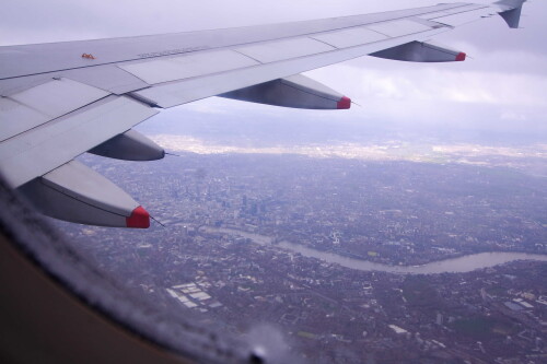 After a bit of cloud surfing, we popped out of the fluffy-stuff on final approach over central London.  This kicked me into a running commentary.

"I can see Adam and Claire's house".

"I can see Waterloo".

"I can see Allen's old house".