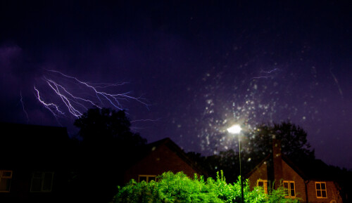 No sleep for me as it all started kicking off at about 1 in the morning.  The strikes came thick and fast as the storms rolled round but never over.

This was out of the back window.  I like the juxtaposition of the (tamed) street lamp and the (wild) lightning but the light spots from the window are kinda distracting.