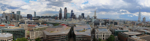 The full image is available at http://gigapan.com/gigapans/116482 - there is another 180° off to the right, round to The Old Bailey

This is made up of about 20 photos taken from the roof of St Paul's Cathedral, at the bottom of the dome. I took this while spending a week in London during the Olympic games. There might be some Wenlocks and Mandevilles visible.

Given that the photos are not taken from a single point, there is a lot of overlap and distortion, and the dreaded wavey horizon. It also took quite a while to work out how to use Hugin as their doc seems to miss some vital information about what half of the options and buttons actually mean (what actually is a panosphere, and what's a stack number for), and that searching for control points in pairs of images is the best way of stiching.

Perhaps one day, I'll go back up and take one from the walkway at the very top of the dome.